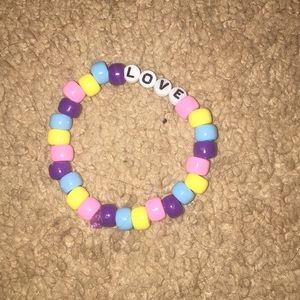 Homage pink yellow blue and purple bead bracelet